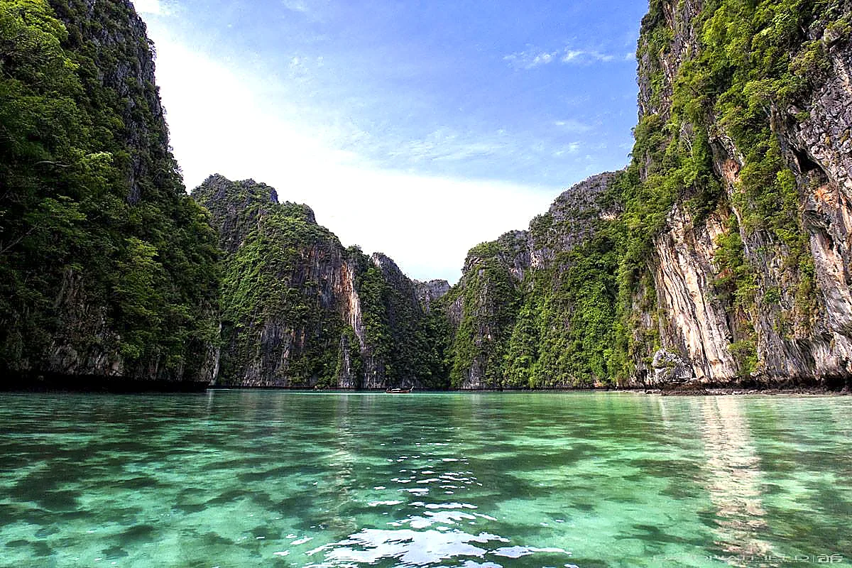 Turquoise lagoon framed by limestone cliffs in the Phi Phi Islands
