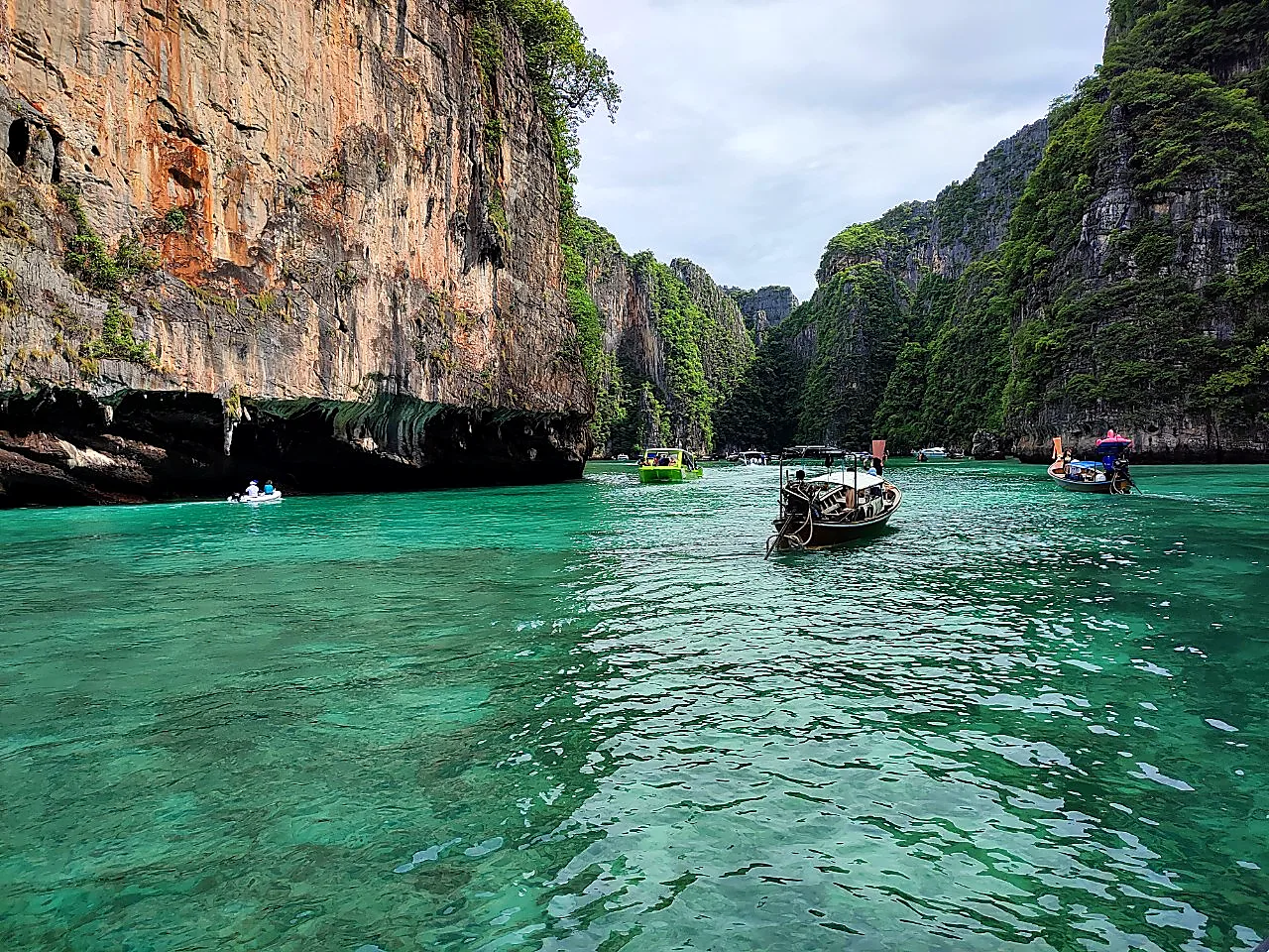 Boat entering the emerald Pileh Lagoon at Phi Phi